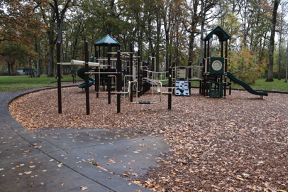Large playground along paved trail – ramp into bark chip surface